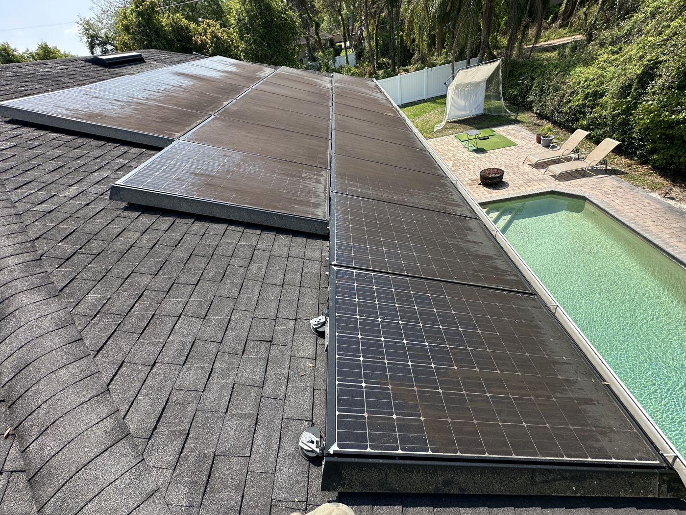 Before: old shingle roof with weathered panels