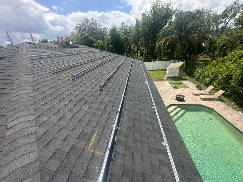New shingle roof with racking rails reinstalled