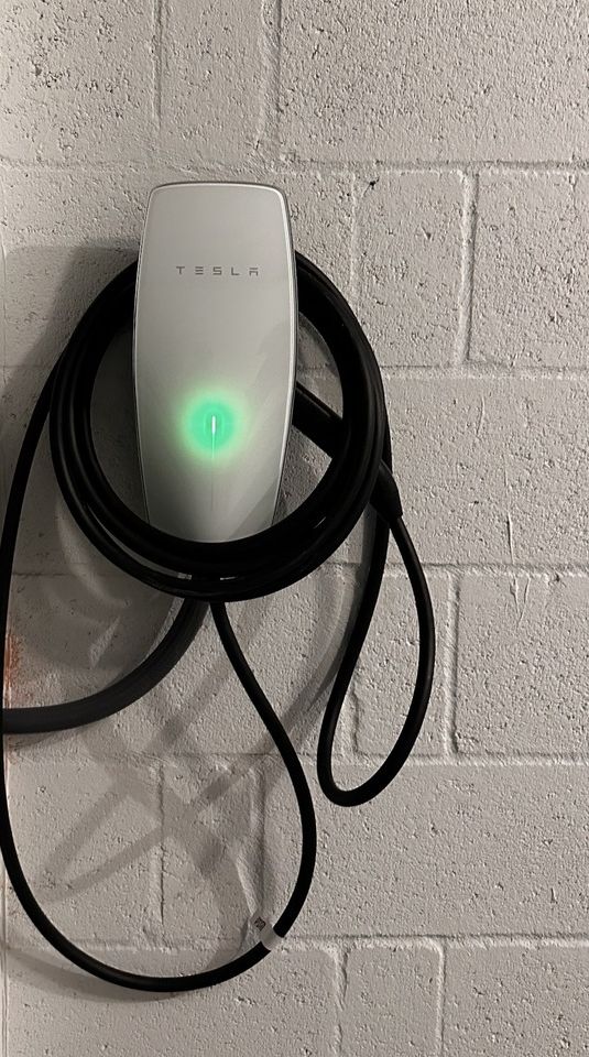 After: Tesla Wall Connector mounted with the cable dressed